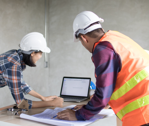 Contractors reviewing plans